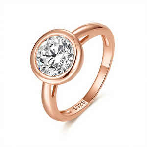 Rose gold ring with a diamond on a white background