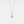 Diamond necklace on a light gray background