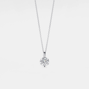 Diamond necklace on a light gray background