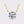 Gold necklace with a round diamond pendant on a light gray background
