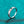 Silver ring with a diamond on a teal textured background