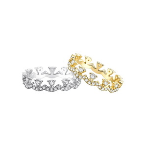 Gold and silver rings with crown designs on a white background