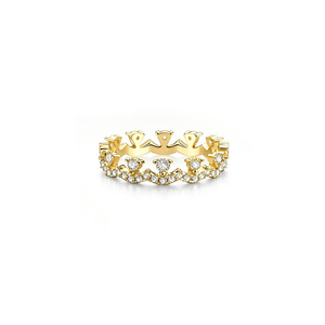Gold ring with diamond accents on a white background