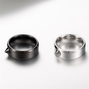 Two metallic bowls, one black and one silver, on a white background