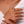 Close-up of a hand wearing multiple rings with gemstones on a white background