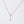 Two necklaces, one with a gold finish and the other with a silver finish, each featuring a star pendant, displayed against a white background.