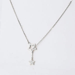 Two necklaces, one with a gold finish and the other with a silver finish, each featuring a star pendant, displayed against a white background.