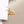 A pair of hoop earrings with starfish charms attached, plated in gold, displayed against a white background.
