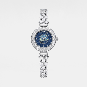 Luxury watch with decorative strap on a white background