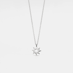 A white gold-plated sterling silver necklace with a sun charm pendant on a chain.