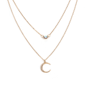 Two gold necklaces with gemstone pendants on a white background