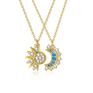 Gold necklaces with sun and moon pendants on a white background