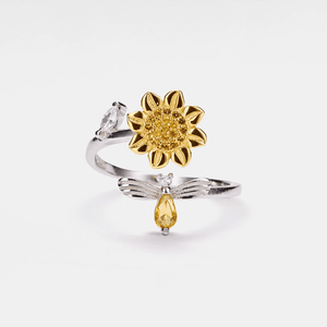 Two rings, one gold and one silver, on a white background