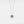 A white gold-plated sterling silver necklace with a sunflower charm and a central projection stone, displayed on a white background.