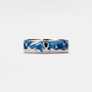 A silver band ring with blue enamel design featuring a fox and a star, inspired by 'The Little Prince'.