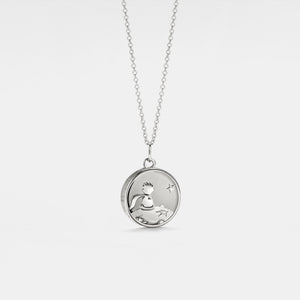 White old plated round locket necklace featuring a “Little Prince” engraved design with a star detail, on a delicate chain against a clean white background.