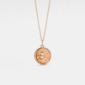 Rose gold plated round locket necklace featuring a “Little Prince” engraved design with a star detail, on a delicate chain against a clean white background.