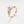 Gold vine ring with a pink heart-shaped gemstone on a white background