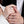 Two holding hands each wearing a silver ring with the little prince and rose flower designs.