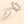Two silver rings with the little prince and rose flower designs on a soft focus background