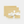 Three gold gift boxes with white ribbons on a light gray background