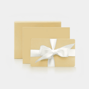 Three gold gift boxes with white ribbons on a light gray background