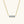 Gold necklace with a bar pendant featuring blue gemstones on a white background
