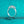 Silver ring with three diamonds on a teal glittery background