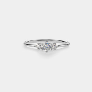 Silver ring with a diamond on a light gray background