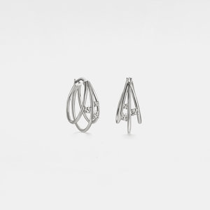 A pair of three stone moissanite hoop earrings with a gold finish.