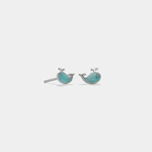Pair of whale-shaped earrings on a white background