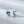 Silver earrings with blue gemstones on a light gray background