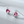 Pair of earrings with pink gemstones on a light gray background