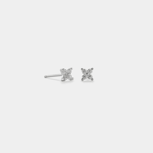 A pair of gold-plated sterling silver stud earrings featuring a four-petal flower design with cubic zirconia in the center.