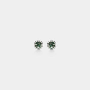 Pair of green gemstone stud earrings on a white background