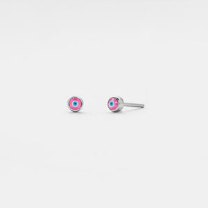 Small silver earrings with colorful stones on a light gray background