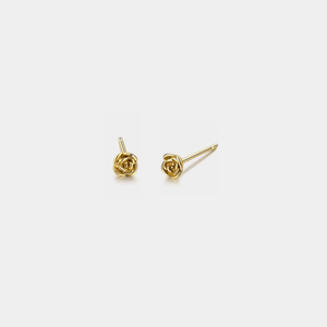 Gold rose-shaped earrings on a white background