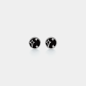 A pair of small black agate star stud earrings with gold plating on a white background.
