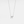 A small bow-shaped pendant necklace with a gold plating on a silver chain, presented against a white background.