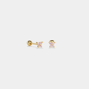 Gold stud earrings with pink gemstones on a white background