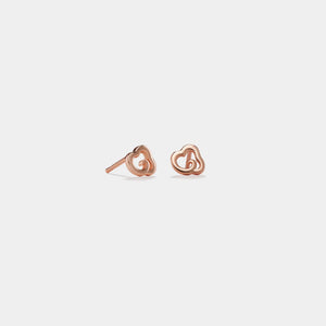 Rose gold heart-shaped earrings on a white background