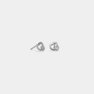 Pair of silver heart-shaped earrings on a light gray background