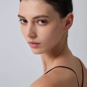 Close-up of a woman's face with a neutral background