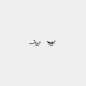 Pair of silver bird-shaped earrings on a white background
