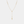 Gold necklace with a cross pendant on a light gray background