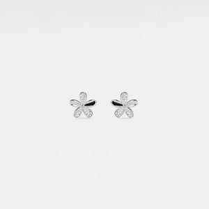 Silver butterfly earrings on a light gray background