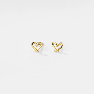 Gold heart-shaped earrings on a light gray background