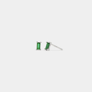 Pair of green gemstone earrings on a white background