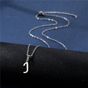 Silver necklace with a 'J' pendant on a black and blue background