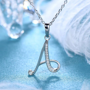 Silver necklace with a 'A' pendant on a blue background